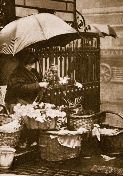 A flower seller at Piccadilly Circus by English Photographer